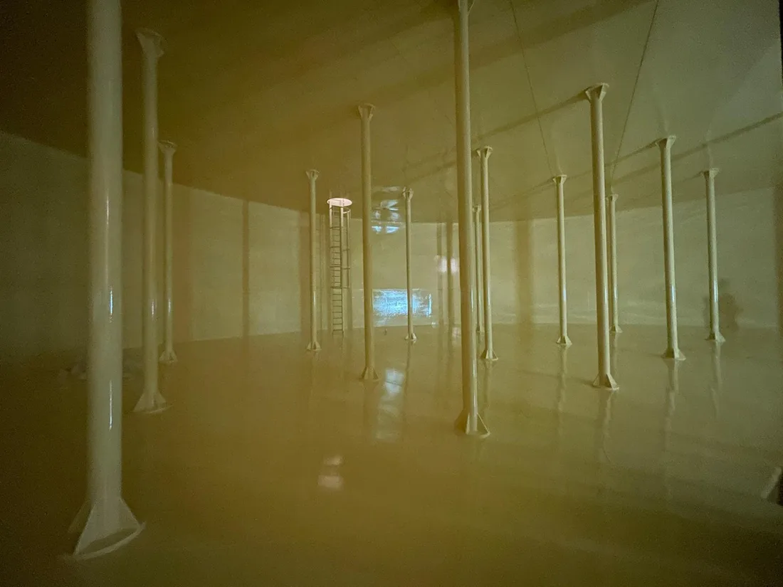 First coat of fuel-resistant lining applied to a blasted steel surface inside an aviation fuel tank